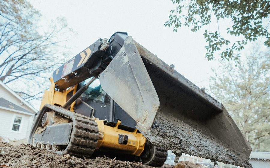 Skid steer clearing land
